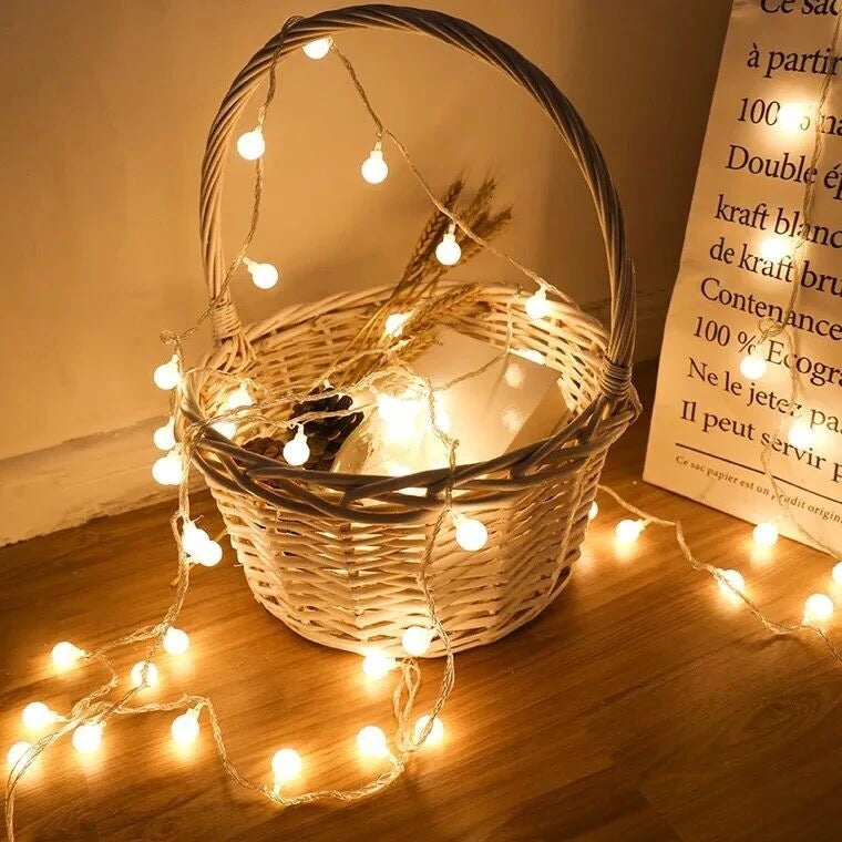 Elevate your space with these versatile 10M LED string lights. Featuring soft, ball-shaped bulbs, they create a warm, inviting ambiance for any occasion, indoors or out. Powered by USB or batteries, you have the flexibility to place them anywhere. Perfect